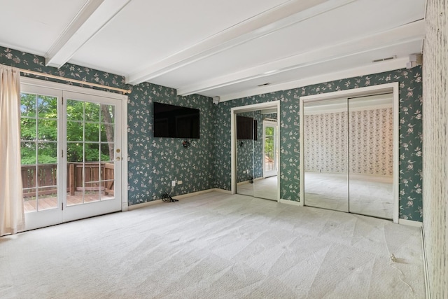 12811 S 82nd Ct, Palos Park, IL 60464 - unfurnished bedroom featuring wallpapered walls, access to outside, multiple closets, beamed ceiling, and carpet floors