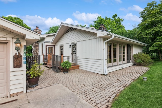 12811 S 82nd Ct, Palos Park, IL 60464 - view of home's exterior with a chimney and a patio
