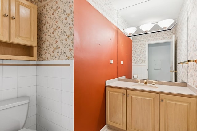 12811 S 82nd Ct, Palos Park, IL 60464 - bathroom featuring wallpapered walls, vanity, wainscoting, toilet, and tile walls