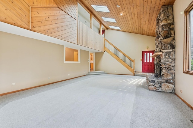 12811 S 82nd Ct, Palos Park, IL 60464 - unfurnished living room featuring carpet flooring, a skylight, high vaulted ceiling, baseboards, and stairs
