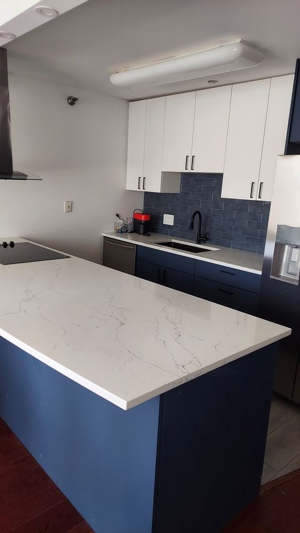 345 N La Salle Dr Unit 3305, Chicago, IL 60654 - kitchen featuring a sink, light stone counters, stainless steel fridge with ice dispenser, tasteful backsplash, and wood finished floors