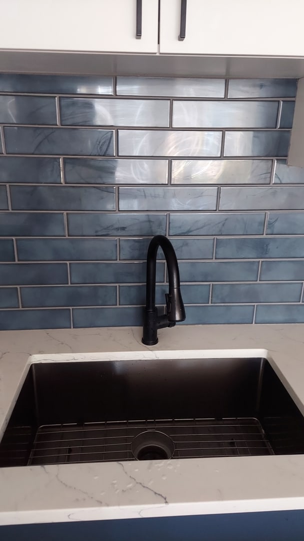 345 N La Salle Dr Unit 3305, Chicago, IL 60654 - kitchen view of a sink, light stone countertops, and tasteful backsplash