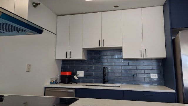 345 N La Salle Dr Unit 3305, Chicago, IL 60654 - kitchen featuring a sink, appliances with stainless steel finishes, backsplash, white cabinets, and range hood