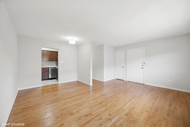 405 Wesley Ave Unit 6, Oak Park, IL 60302 - unfurnished living room featuring light wood-style floors and baseboards