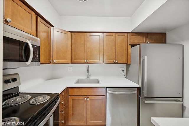 405 Wesley Ave Unit 6, Oak Park, IL 60302 - kitchen featuring stainless steel appliances, a sink, light countertops, and brown cabinetry