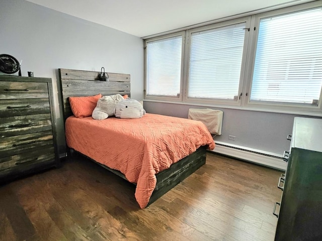 7251 Randolph St Unit C5, Forest Park, IL 60130 - bedroom with a baseboard heating unit and wood finished floors