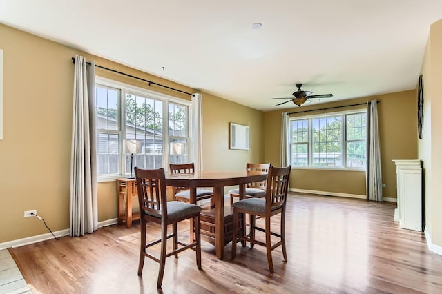 15157 Hilltop Ct, Orland Park, IL 60462 - dining area featuring a ceiling fan and light wood-style flooring