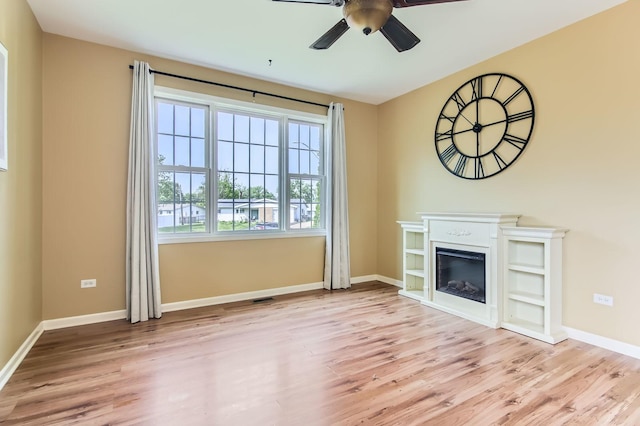 15157 Hilltop Ct, Orland Park, IL 60462 - unfurnished living room featuring ceiling fan, wood finished floors, and a glass covered fireplace