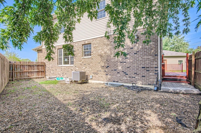 15157 Hilltop Ct, Orland Park, IL 60462 - rear view of property featuring a fenced backyard, brick siding, and a deck