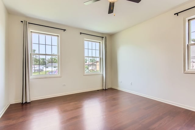 15157 Hilltop Ct, Orland Park, IL 60462 - empty room with healthy amount of natural light, dark wood finished floors, and ceiling fan