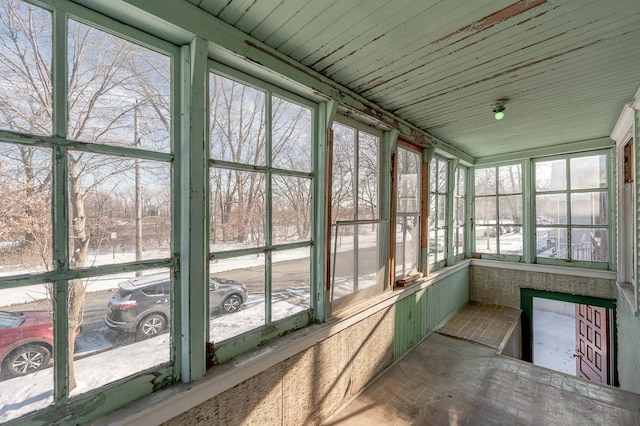 unfurnished sunroom with plenty of natural light