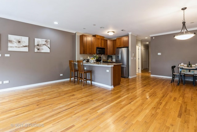 934 W Cuyler Ave Unit 2D, Chicago, IL 60613 - kitchen with black microwave, stainless steel refrigerator with ice dispenser, a peninsula, light wood-type flooring, and ornamental molding