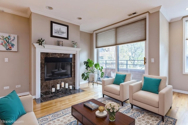 934 W Cuyler Ave Unit 2D, Chicago, IL 60613 - living room featuring crown molding, wood finished floors, a premium fireplace, baseboards, and recessed lighting