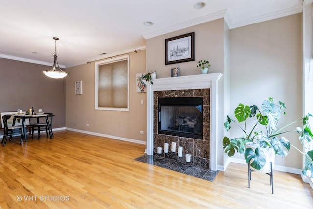 934 W Cuyler Ave Unit 2D, Chicago, IL 60613 - living room with ornamental molding, wood finished floors, baseboards, and a high end fireplace