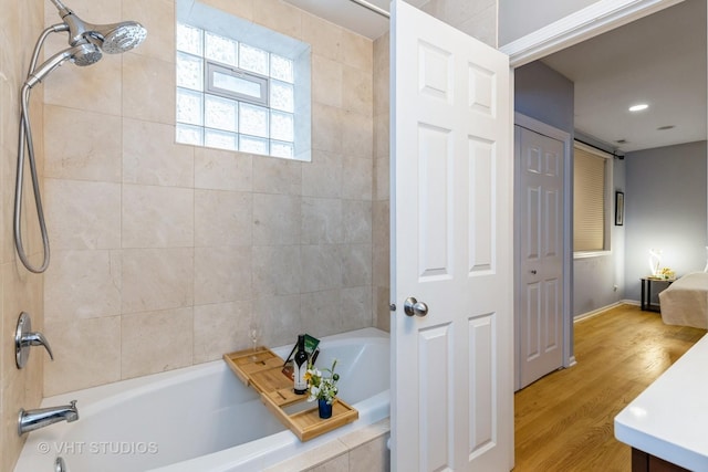 934 W Cuyler Ave Unit 2D, Chicago, IL 60613 - bathroom with tub / shower combination, wood finished floors, vanity, recessed lighting, and baseboards