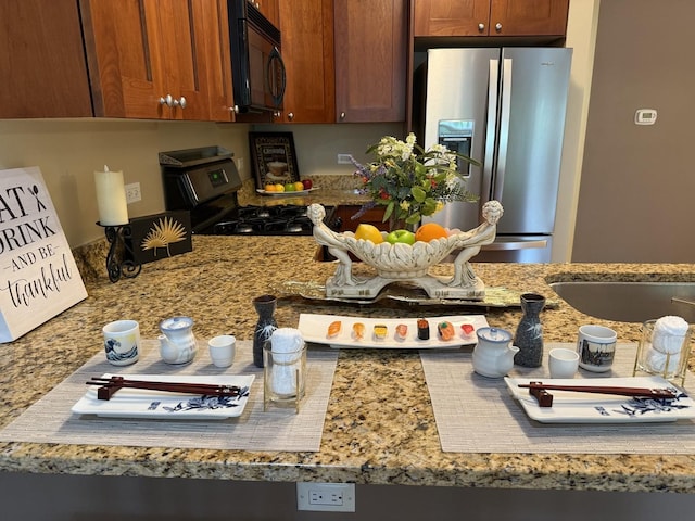 934 W Cuyler Ave Unit 2D, Chicago, IL 60613 - kitchen with appliances with stainless steel finishes, brown cabinets, and light stone counters