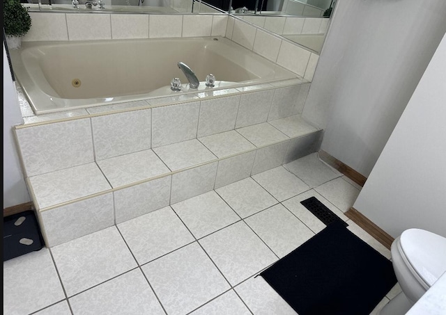 11224 Marley Brook Ct, Orland Park, IL 60467 - bathroom with baseboards, tile patterned flooring, a jetted tub, and toilet
