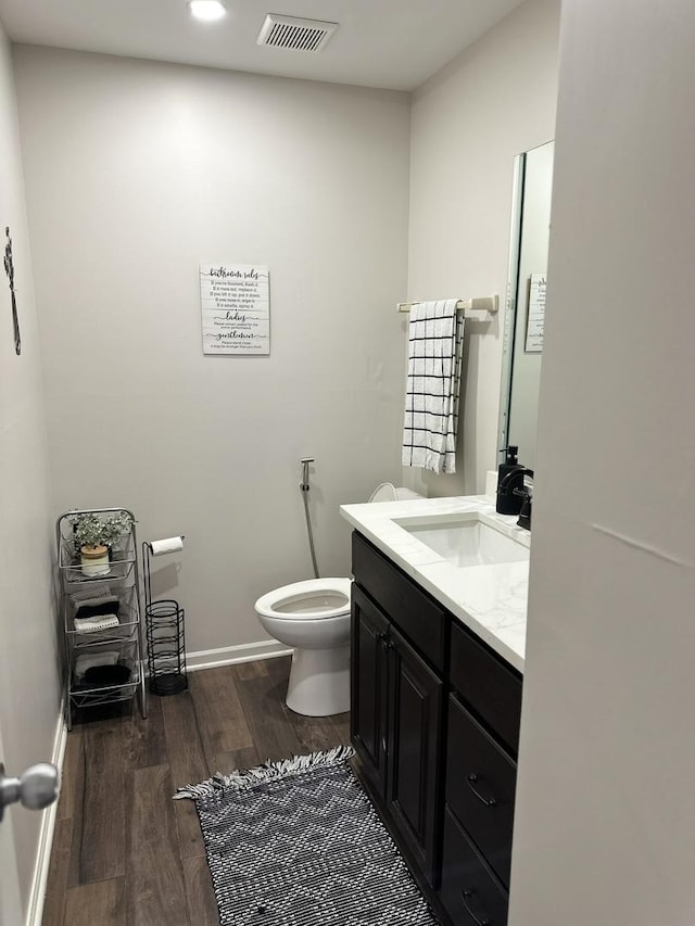 11224 Marley Brook Ct, Orland Park, IL 60467 - bathroom with wood finished floors, vanity, toilet, baseboards, and recessed lighting
