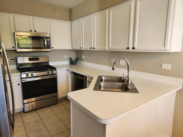 2473 Dickens Dr, Aurora, IL 60503 - kitchen featuring appliances with stainless steel finishes, a sink, white cabinetry, light countertops, and light tile patterned floors