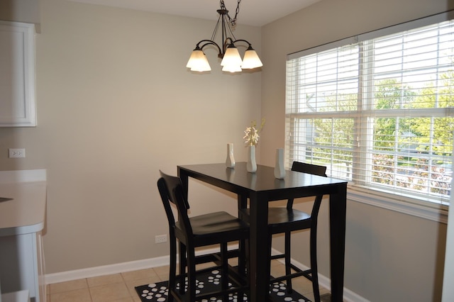 2473 Dickens Dr, Aurora, IL 60503 - dining space with a chandelier, baseboards, and light tile patterned floors