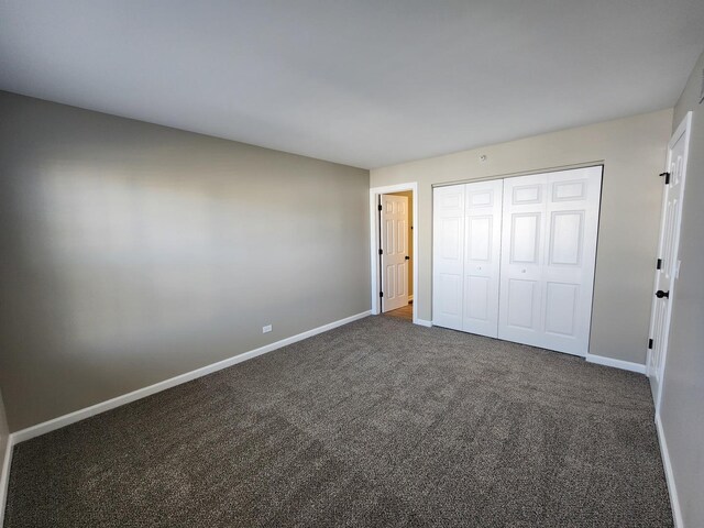 2473 Dickens Dr, Aurora, IL 60503 - unfurnished bedroom with carpet floors, baseboards, and a closet