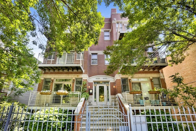 6025 N Ridge Ave Unit 1W, Chicago, IL 60660 - view of front facade featuring brick siding
