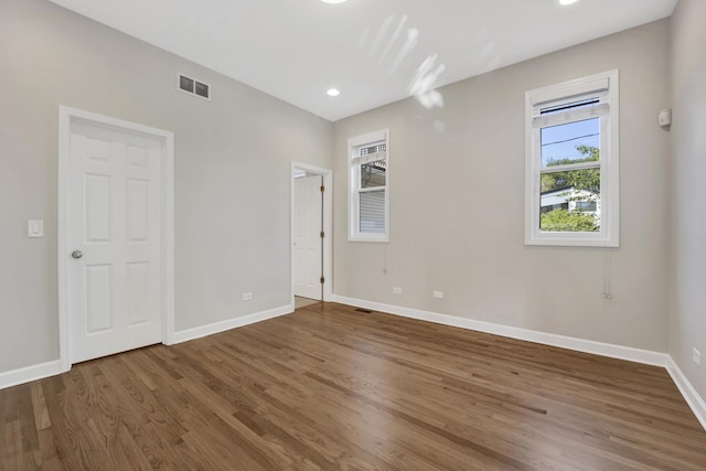 6025 N Ridge Ave Unit 1W, Chicago, IL 60660 - spare room featuring wood finished floors and recessed lighting