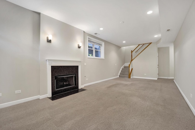 6025 N Ridge Ave Unit 1W, Chicago, IL 60660 - unfurnished living room with carpet, stairway, recessed lighting, and a fireplace with flush hearth