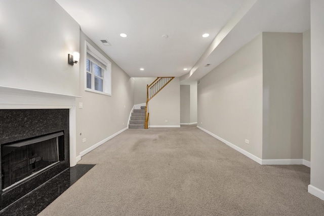 6025 N Ridge Ave Unit 1W, Chicago, IL 60660 - unfurnished living room with stairway, carpet, recessed lighting, and a high end fireplace