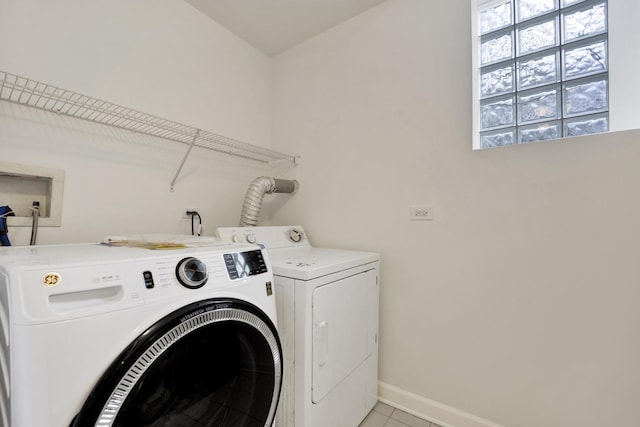 6025 N Ridge Ave Unit 1W, Chicago, IL 60660 - washroom with washer and dryer and light tile patterned floors