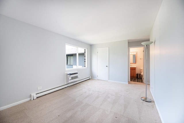 922 E Old Willow Rd Unit 204, Prospect Heights, IL 60070 - unfurnished bedroom with a baseboard heating unit, an AC wall unit, carpet floors, baseboards, and ensuite bath