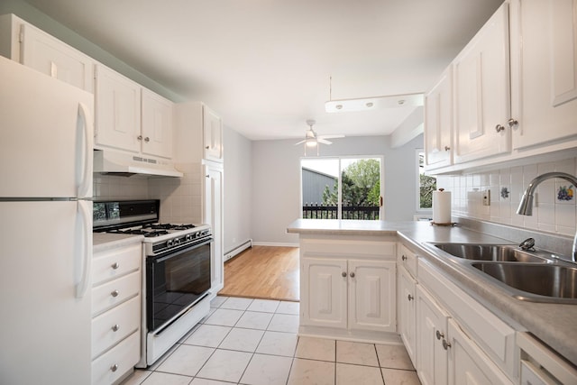 922 E Old Willow Rd Unit 204, Prospect Heights, IL 60070 - kitchen with white appliances, a sink, baseboard heating, under cabinet range hood, and decorative backsplash