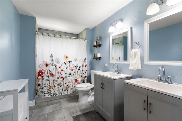 bathroom featuring two vanities, toilet, tile patterned floors, and a shower with shower curtain