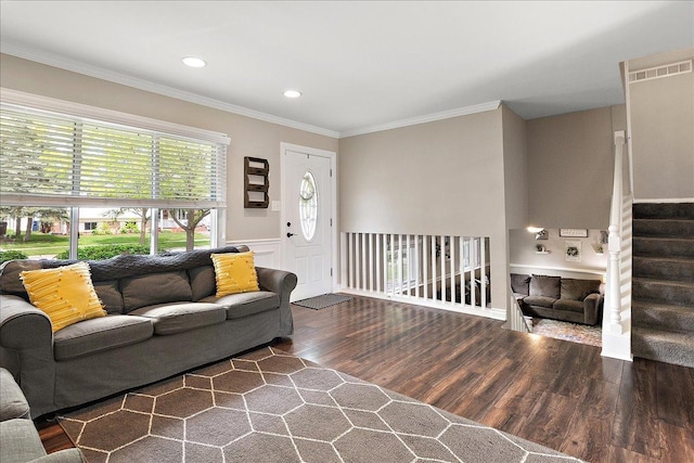 living room with wood finished floors, crown molding, stairway, a wainscoted wall, and recessed lighting
