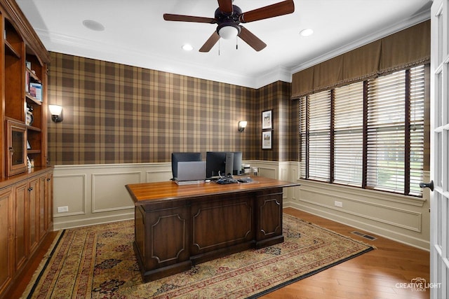 office area featuring ceiling fan, light wood-type flooring, a wainscoted wall, recessed lighting, and ornamental molding