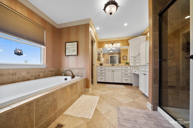 full bathroom featuring a stall shower, ornamental molding, vanity, a bath, and tile patterned floors