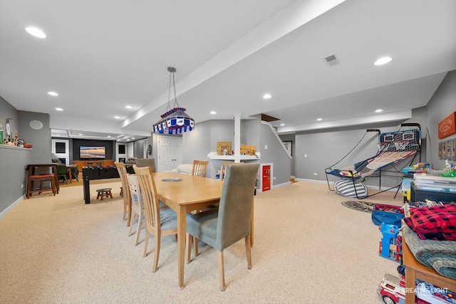 dining room featuring light carpet, baseboards, recessed lighting, and stairs