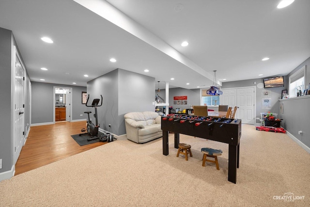 rec room with baseboards, recessed lighting, and wood finished floors