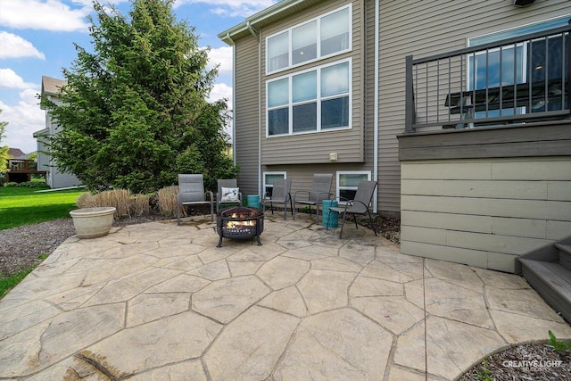 view of patio / terrace with a fire pit