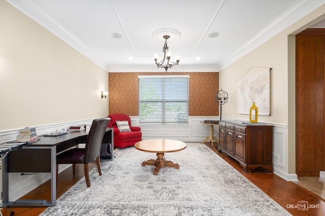 office area featuring a chandelier, ornamental molding, wood finished floors, a wainscoted wall, and wallpapered walls