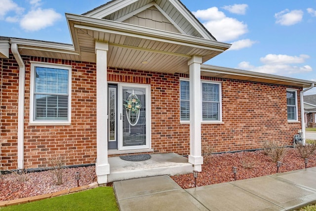 property entrance with brick siding
