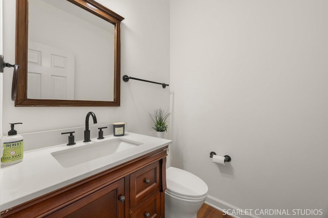 700 Wilmore Dr, Oswego, IL 60543 - half bathroom with toilet, vanity, and baseboards