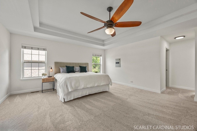 700 Wilmore Dr, Oswego, IL 60543 - carpeted bedroom with a raised ceiling, baseboards, electric panel, and ceiling fan