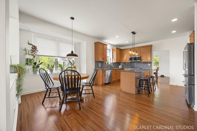 700 Wilmore Dr, Oswego, IL 60543 - dining area with dark wood-style flooring, healthy amount of natural light, recessed lighting, and baseboards