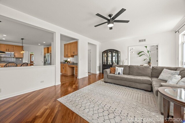 700 Wilmore Dr, Oswego, IL 60543 - living room with ceiling fan, dark wood-style floors, recessed lighting, and baseboards