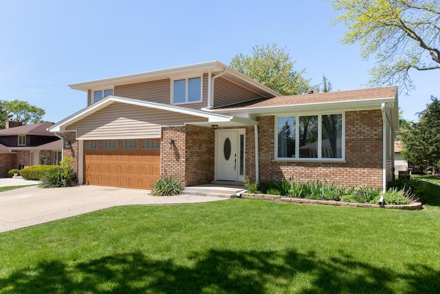12 James Dr, Westmont, IL 60559 - split level home featuring brick siding, a front yard, driveway, and a garage