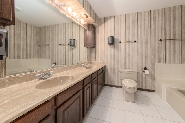 12 James Dr, Westmont, IL 60559 - bathroom featuring wallpapered walls, toilet, tile patterned floors, a tub, and double vanity