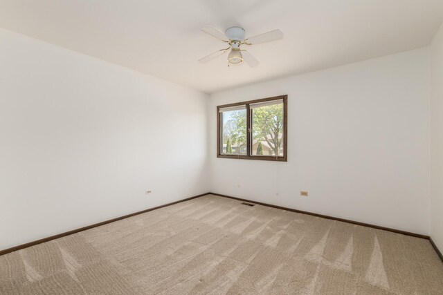 12 James Dr, Westmont, IL 60559 - unfurnished room featuring light colored carpet, a ceiling fan, and baseboards