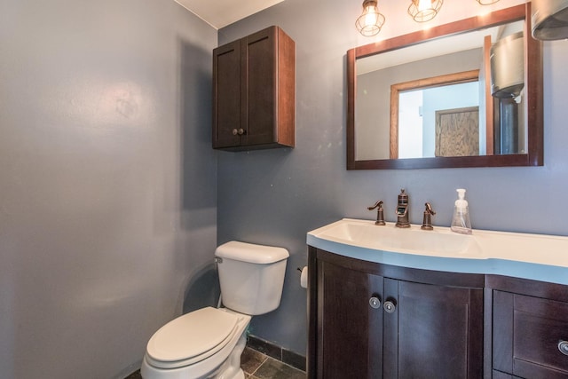 12 James Dr, Westmont, IL 60559 - bathroom featuring toilet, vanity, and baseboards