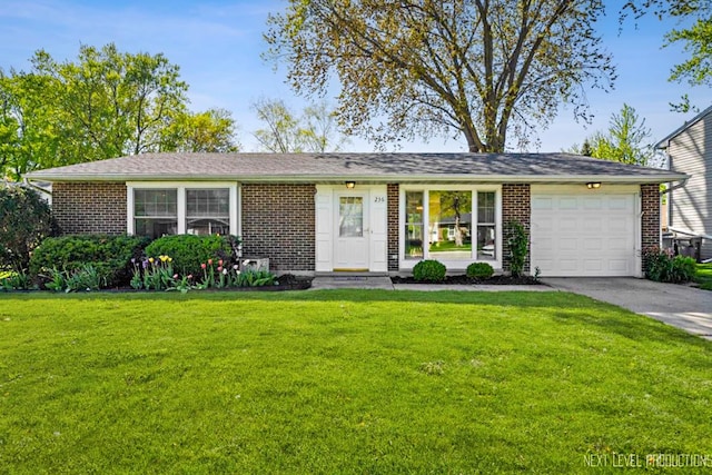 ranch-style home with an attached garage, brick siding, driveway, and a front yard